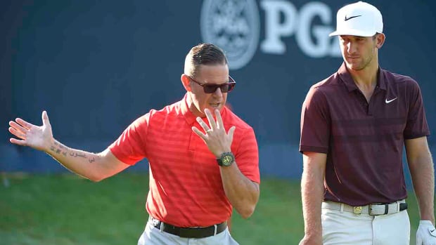 Teacher Sean Foley works with Kevin Chappell at the 2018 PGA Championship.